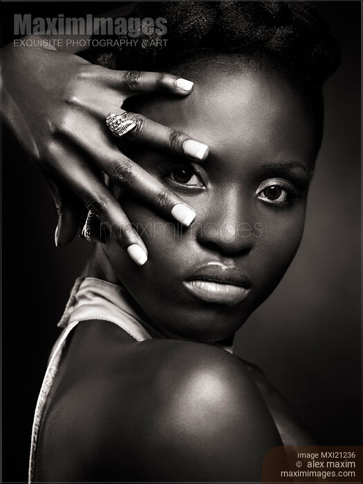 Stock photo of Black Woman Expressive Portrait Buy commercial use license at MaximImages