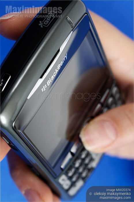 Stock photo of BlackBerry 8310 Curve Smartphone in a Hand Buy commercial use license at MaximImages