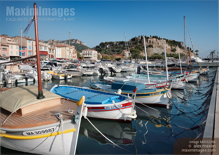 Boats docked in a quay of Cassis port town in France Stock photo of Boats docked in a quay of Cassis port town in France Buy commercial use license at MaximImages