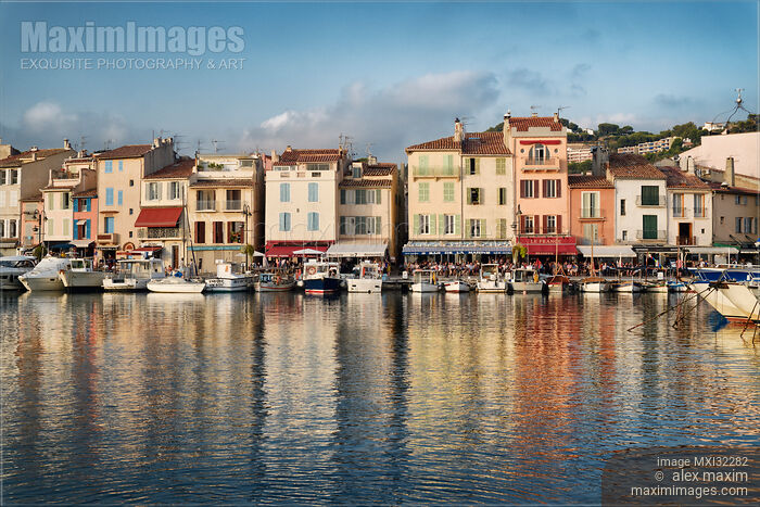 Boats in harbor of Cassis commune quay beautiful French architecture Southern France port town Stock photo of Boats in harbor of Cassis commune quay beautiful French architecture Southern France port town Buy commercial use license at MaximImages