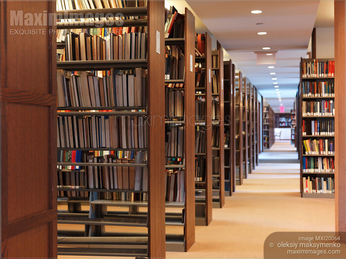 Stock photo of Bookshelves in a Library Buy commercial use license at MaximImages