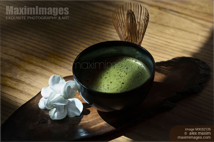 Stock photo of Bowl of Japanese Matcha green tea with a bamboo whisk Artistic still life Buy commercial use license at MaximImages