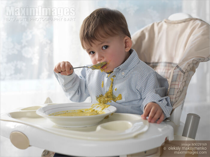 Stock photo of Boy Eating Soup Buy commercial use license at MaximImages