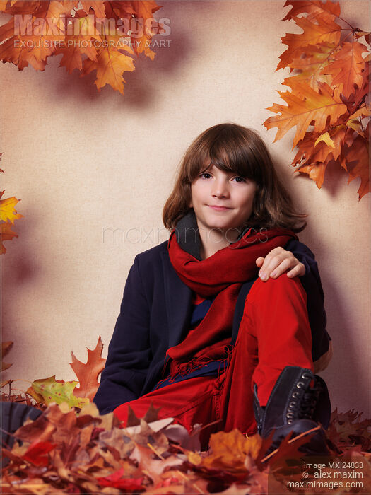 Boy in fall clothes sitting on red autumn leaves Stock photo of Boy in fall clothes sitting on red autumn leaves Buy commercial use license at MaximImages