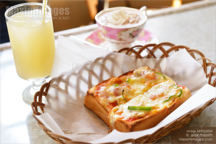 Breakfast pizza bread and drinks Stock photo of Breakfast pizza bread and drinks Buy commercial use license at MaximImages