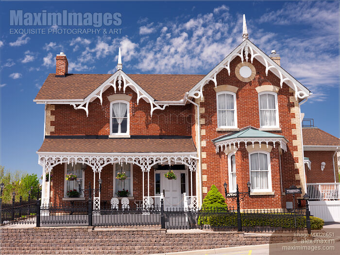 Stock photo of Brick house in Ontario Gothic architectural style Buy commercial use license at MaximImages