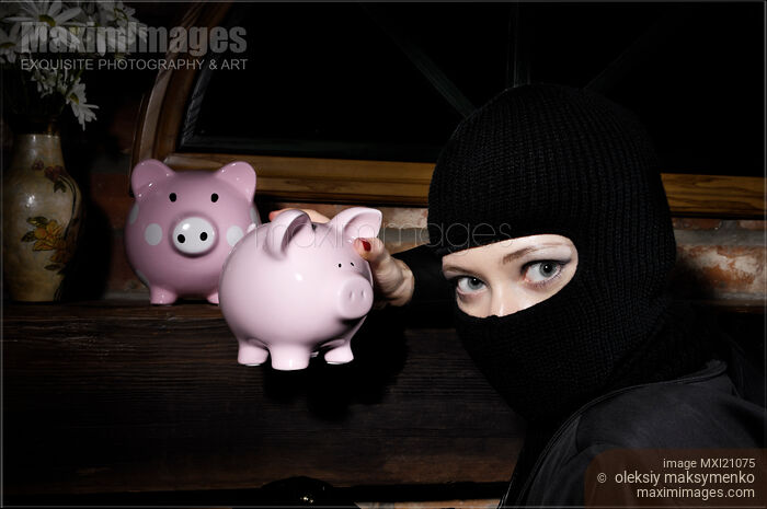 Stock photo of Burglar Stealing Piggy Banks Buy commercial use license at MaximImages