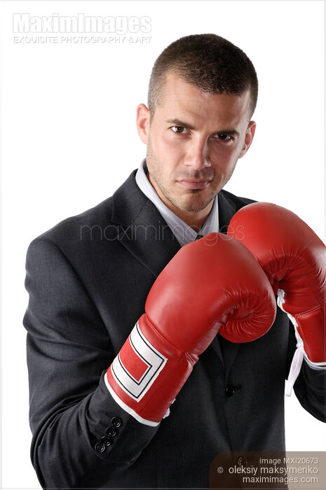 Stock photo of Businessman in Boxing Gloves Buy commercial use license at MaximImages