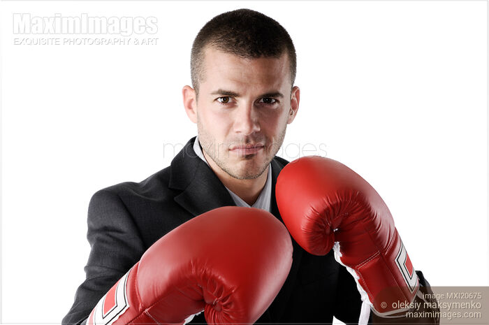 Stock photo of Businessman in Boxing Gloves Buy commercial use license at MaximImages