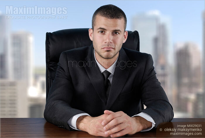 Stock photo of Businessman in the Office Buy commercial use license at MaximImages