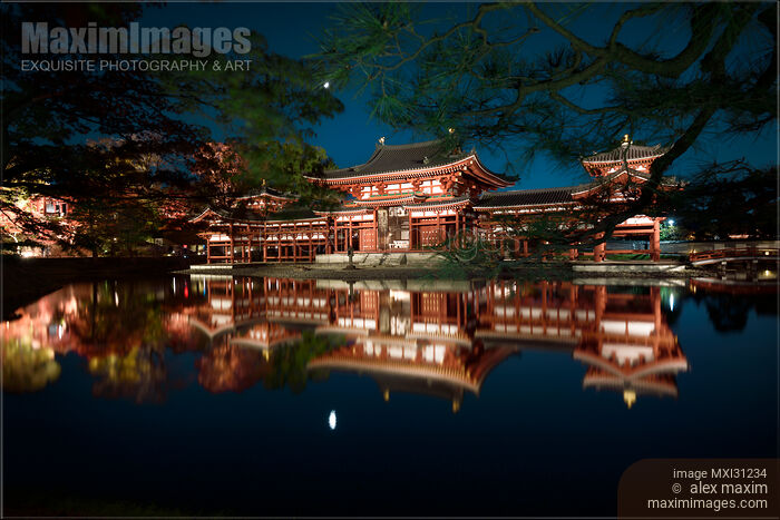 Byodoin temple Phoenix Hall illuminated with lights in nighttime scenery reflecting in calm water of garden pond Stock photo of Byodoin temple Phoenix Hall illuminated with lights in nighttime scenery reflecting in calm water of garden pond Buy commercial use license at MaximImages