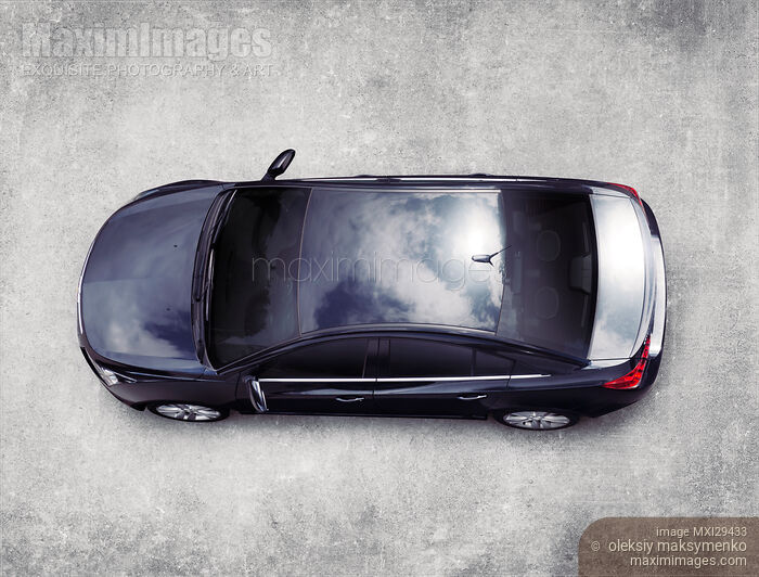 Stock photo of Cadillac XTS luxury car on concrete pavement top view Buy commercial use license at MaximImages