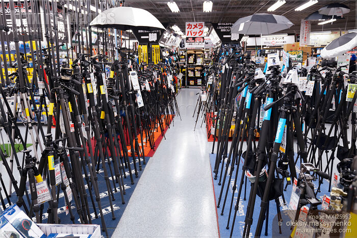 Stock photo of Camera tripods at electronic store Buy commercial use license at MaximImages