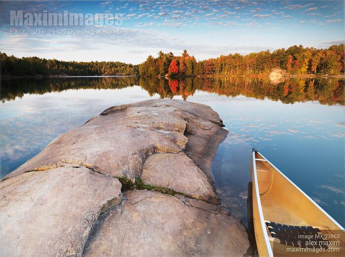 Canoe at a Rocky Shore Autumn Nature Scenery Stock photo of Canoe at a Rocky Shore Autumn Nature Scenery Buy commercial use license at MaximImages