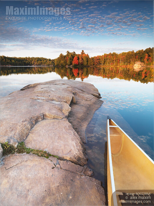 Canoe at a Rocky Shore Autumn Nature Scenery Stock photo of Canoe at a Rocky Shore Autumn Nature Scenery Buy commercial use license at MaximImages