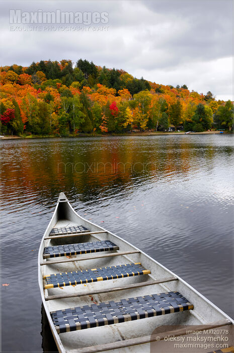 Stock photo of Canoe on a Lake Buy commercial use license at MaximImages