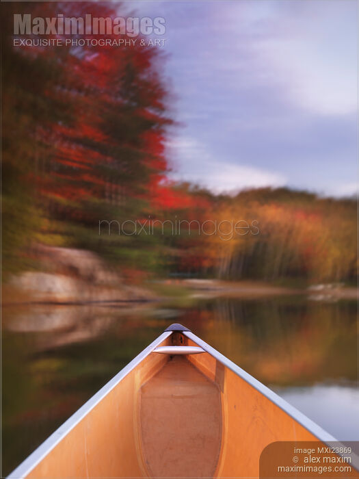 Canoe on a Lake in Autumn Stock photo of Canoe on a Lake in Autumn Buy commercial use license at MaximImages