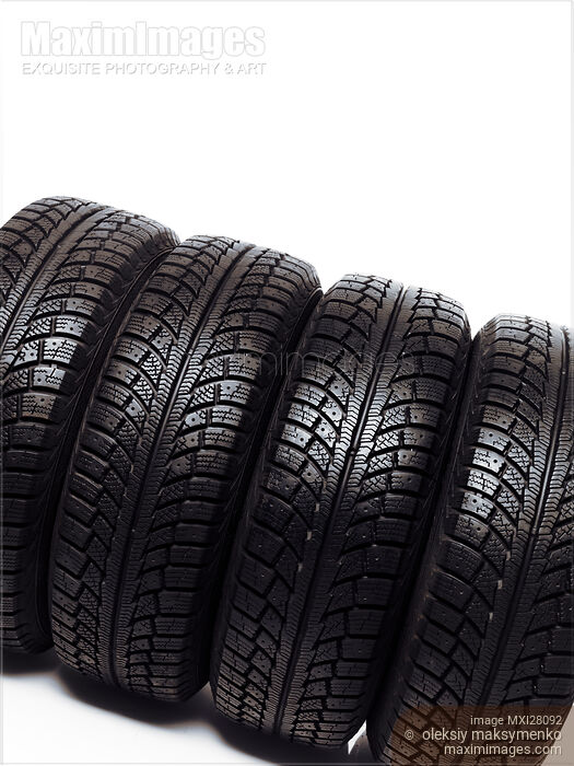 Stock photo of Car snow winter tires on white Buy commercial use license at MaximImages