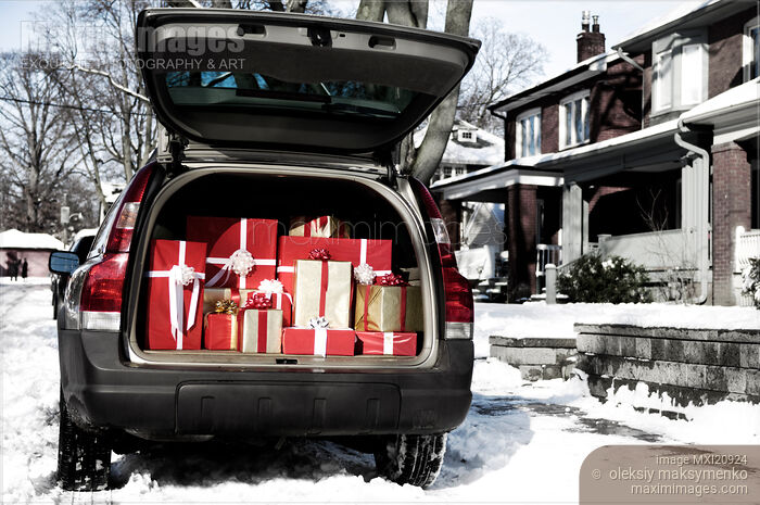 Stock photo of Car with open trunk full of gift boxes Christmas presents Buy commercial use license at MaximImages