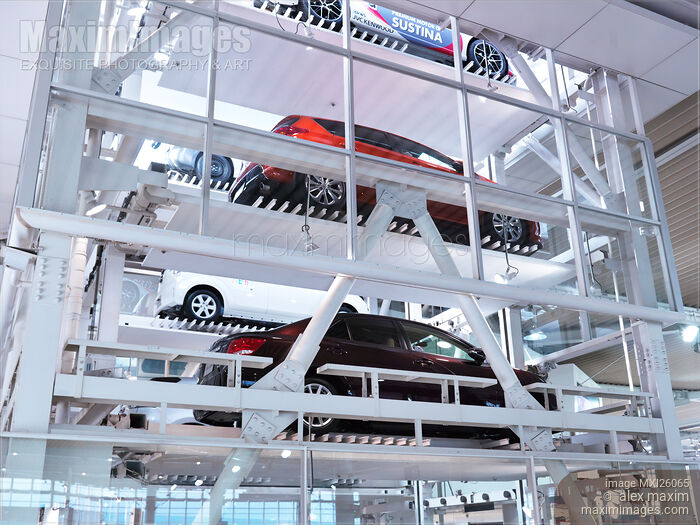 Stock photo of Cars in multi-level parking garage Buy commercial use license at MaximImages