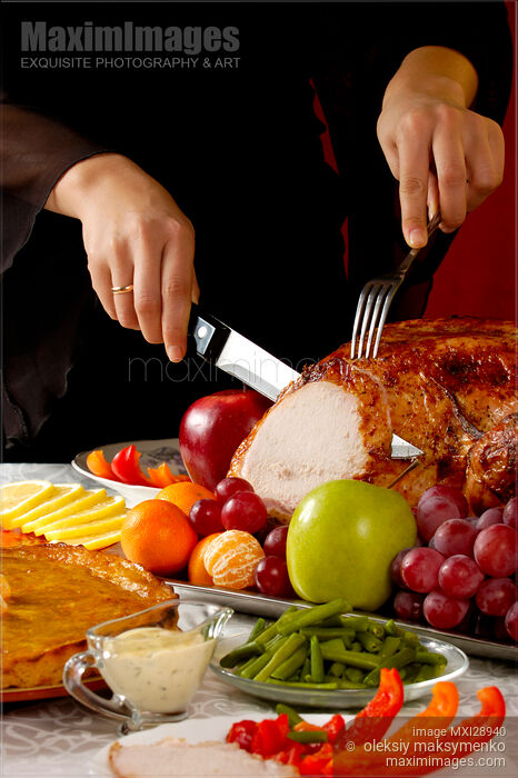 Stock photo of Carving Thanksgiving Turkey Buy commercial use license at MaximImages