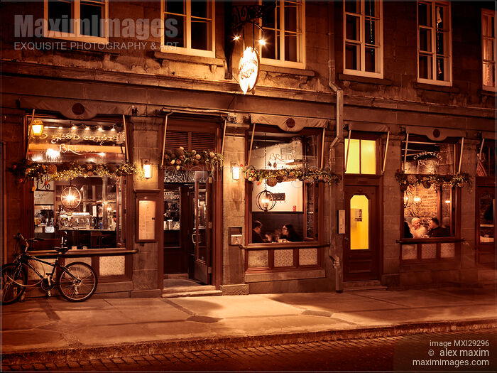 Stock photo of Casse Crepe Breton restaurant illuminated display at night on Rue Saint-Jean in Quebec City Buy commercial use license at MaximImages