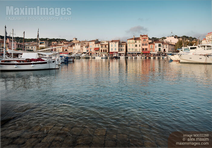 Stock photo of Cassis port town harbor with boats and colorful houses in Southern France Buy commercial use license at MaximImages