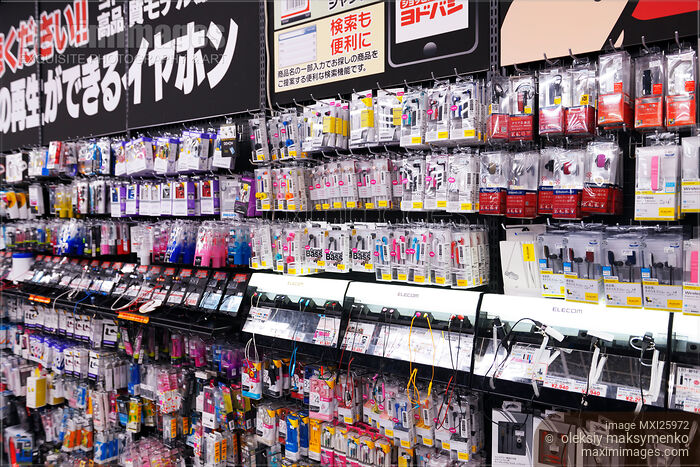 Stock photo of Cellphone accessories and earphones at electronics store Buy commercial use license at MaximImages