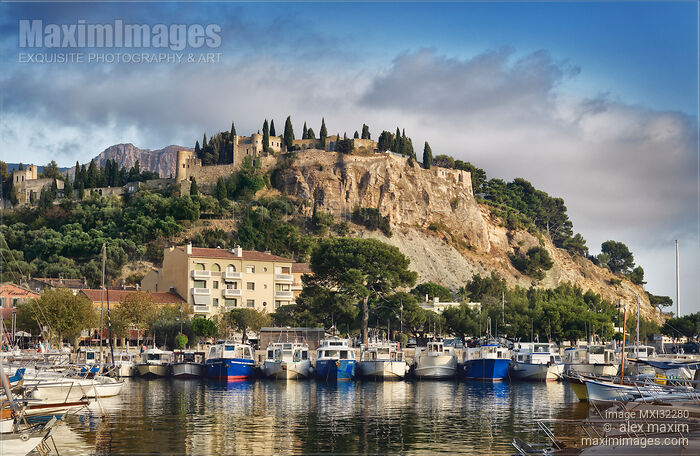 Stock photo of Chateau de Cassis French castle on cliff-top in Cassis port town view from harbor Southern France Buy commercial use license at MaximImages