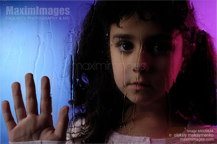 Stock photo of Child Behind Window Pane Buy commercial use license at MaximImages