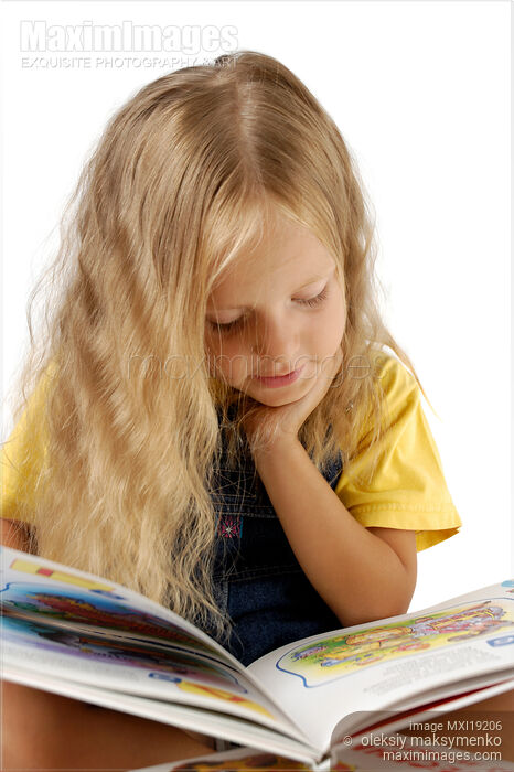Stock photo of Child Reading a Book Buy commercial use license at MaximImages