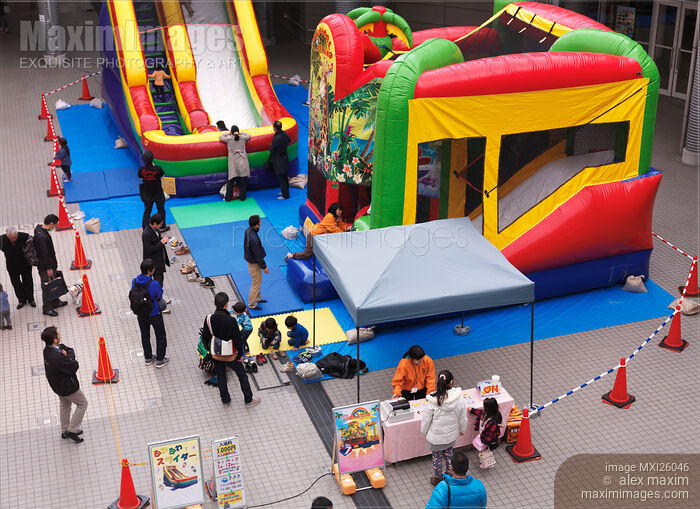 Children playground with inflatable rides Stock photo of Children playground with inflatable rides Buy commercial use license at MaximImages