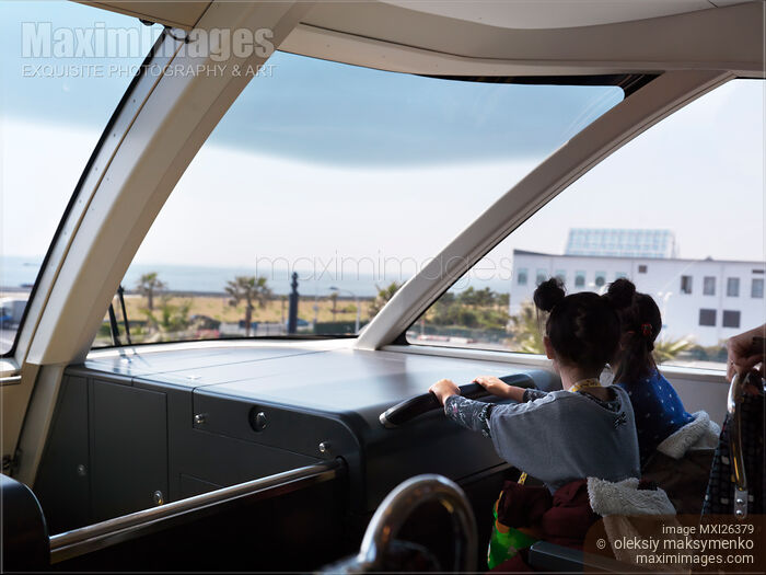 Stock photo of Children riding Disney Resort Line monorail train in Tokyo Buy commercial use license at MaximImages