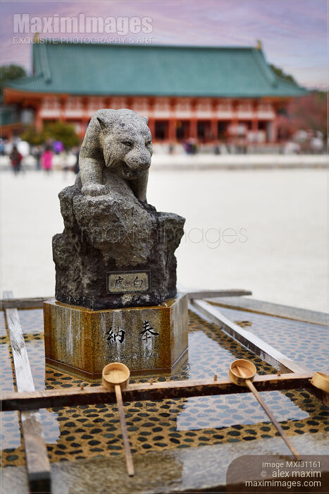 Stock photo of Chozuya water basing with carved stone panther at Heian Shrine Buy commercial use license at MaximImages