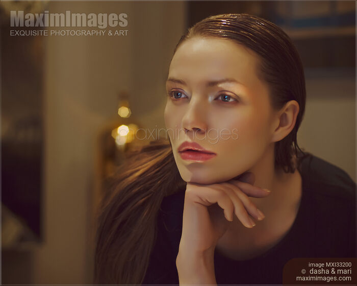 Stock photo of Cinematic style portrait of a beautiful woman face with a pensive look with luxurious high-end styling Buy commercial use license at MaximImages