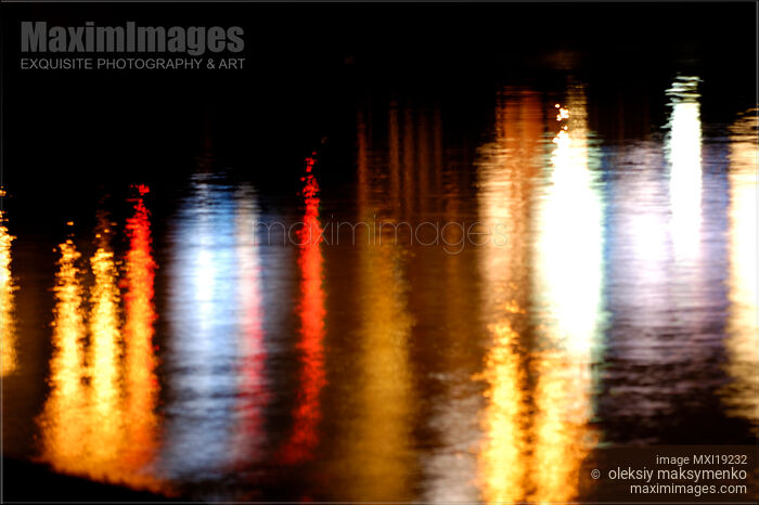 City lights reflecting in water Stock photo of City lights reflecting in water Buy commercial use license at MaximImages