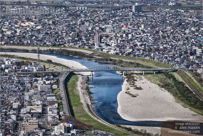 Stock photo of City of Gifu aerial scenery bridge over Nagara River and buildings in a densly populated city landscape Buy commercial use license at MaximImages
