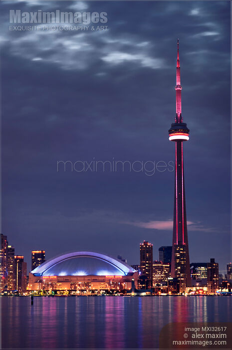 Stock photo of City of Toronto waterfront skyline with CN tower in dramatic night scenery Buy commercial use license at MaximImages