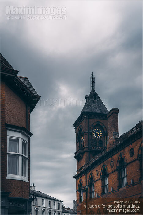 Stock photo of Clock tower in historic dramatic city scenery in Northern Ireland. Buy commercial use license at MaximImages