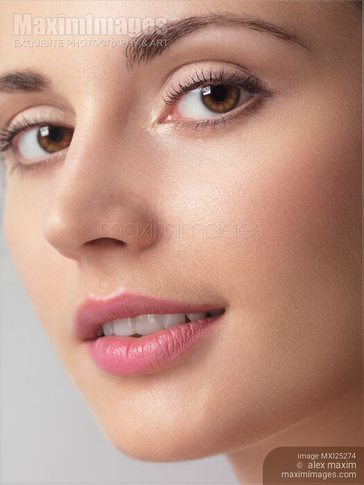 Closeup beauty portrait of young woman face Stock photo of Closeup beauty portrait of young woman face Buy commercial use license at MaximImages