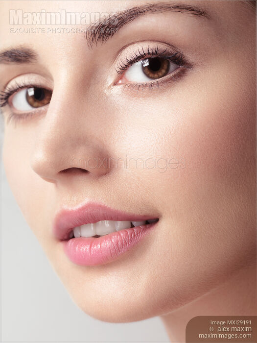 Closeup beauty portrait of young woman face with brown eyes Stock photo of Closeup beauty portrait of young woman face with brown eyes Buy commercial use license at MaximImages