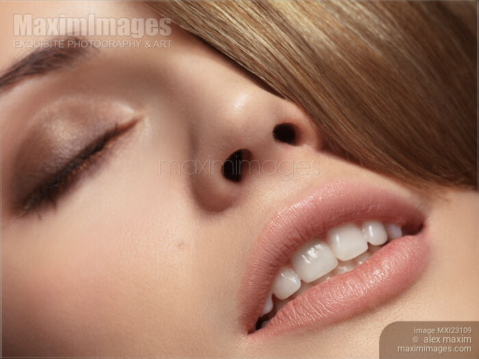 Closeup of a Beautiful Young Woman Face Stock photo of Closeup of a Beautiful Young Woman Face Buy commercial use license at MaximImages