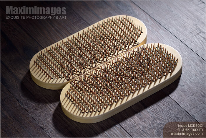 Stock photo of Closeup of a Sadhu Board Yogic board of sharp metal nails Buy commercial use license at MaximImages