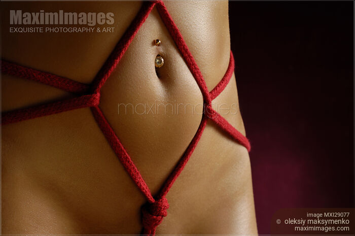 Stock photo of Closeup of a Stomach with Decorative Rope Bondage Shibari Buy commercial use license at MaximImages