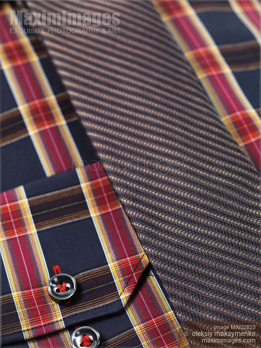 Stock photo of Closeup of a tartan shirt with a necktie Buy commercial use license at MaximImages