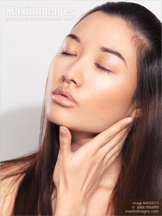 Closeup of a young asian woman face Stock photo of Closeup of a young asian woman face Buy commercial use license at MaximImages