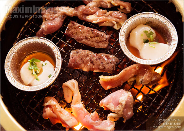 Closeup of beef and scallops grilled on fire Stock photo of Closeup of beef and scallops grilled on fire Buy commercial use license at MaximImages