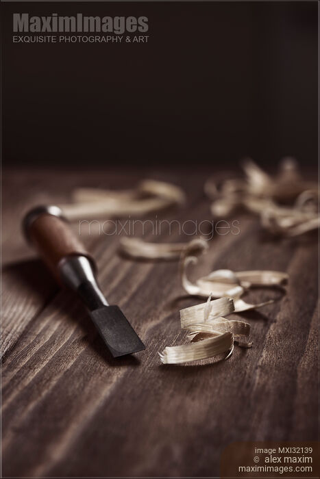 Stock photo of Closeup of Chisel and wood shavings Carpentry still life Buy commercial use license at MaximImages