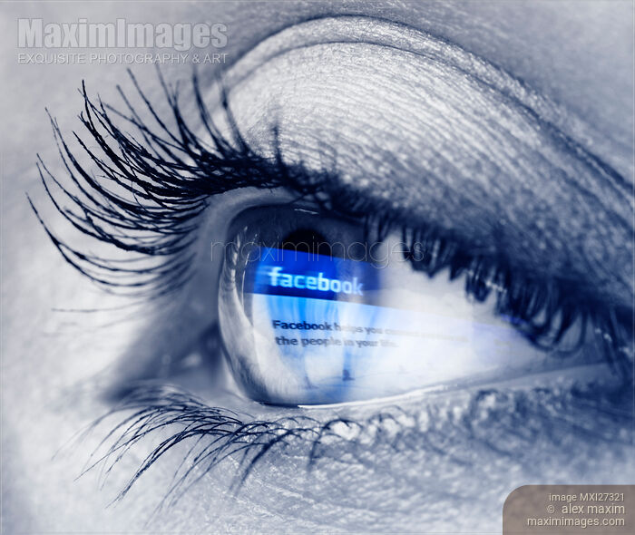 Stock photo of Closeup of eye with blue Facebook logo reflecting in it Buy commercial use license at MaximImages