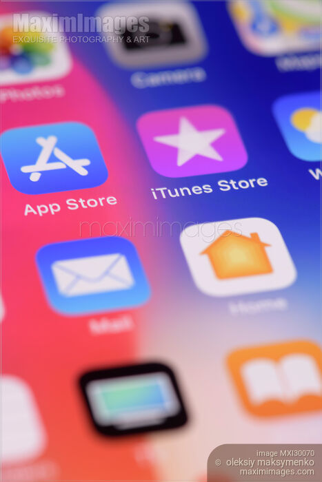 Closeup of iPhone screen with app icons on colorful display Stock photo of Closeup of iPhone screen with app icons on colorful display Buy commercial use license at MaximImages